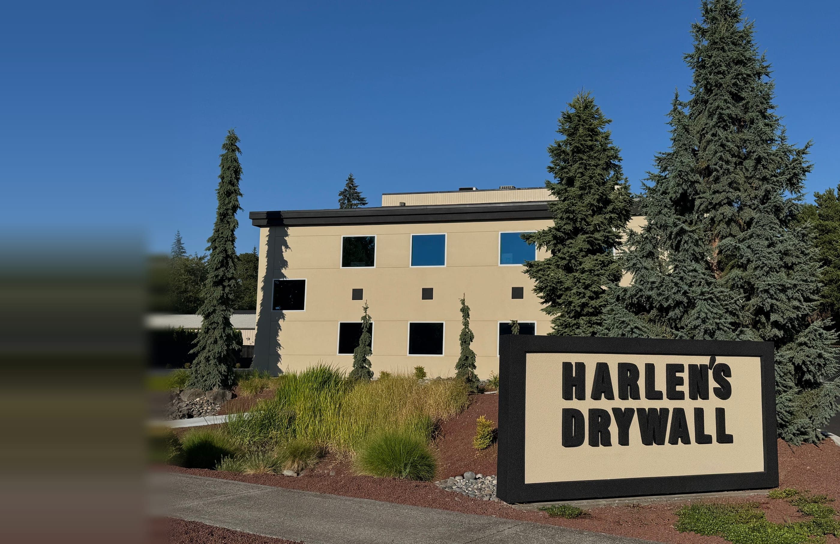 Harlen's Drywall Co. headquarters in Vancouver, Washington, with the company monument sign out front