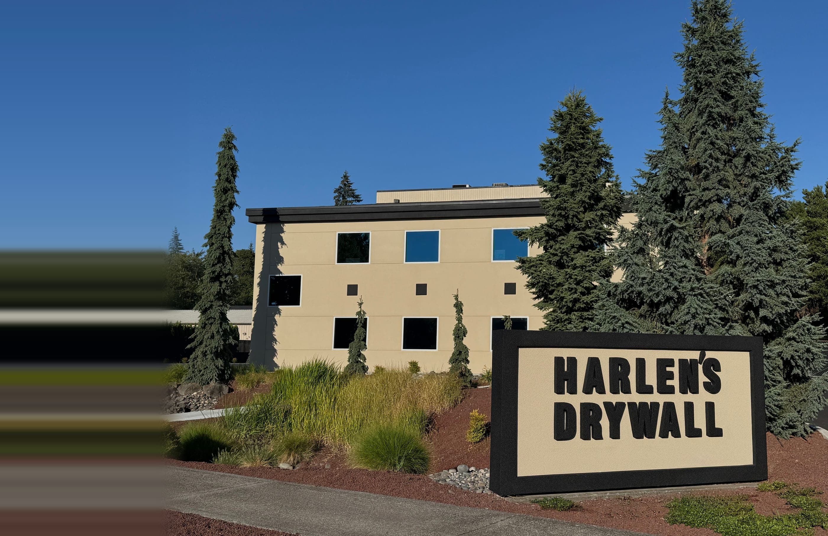 Harlen's Drywall Co. headquarters in Vancouver, Washington, with the company monument sign out front