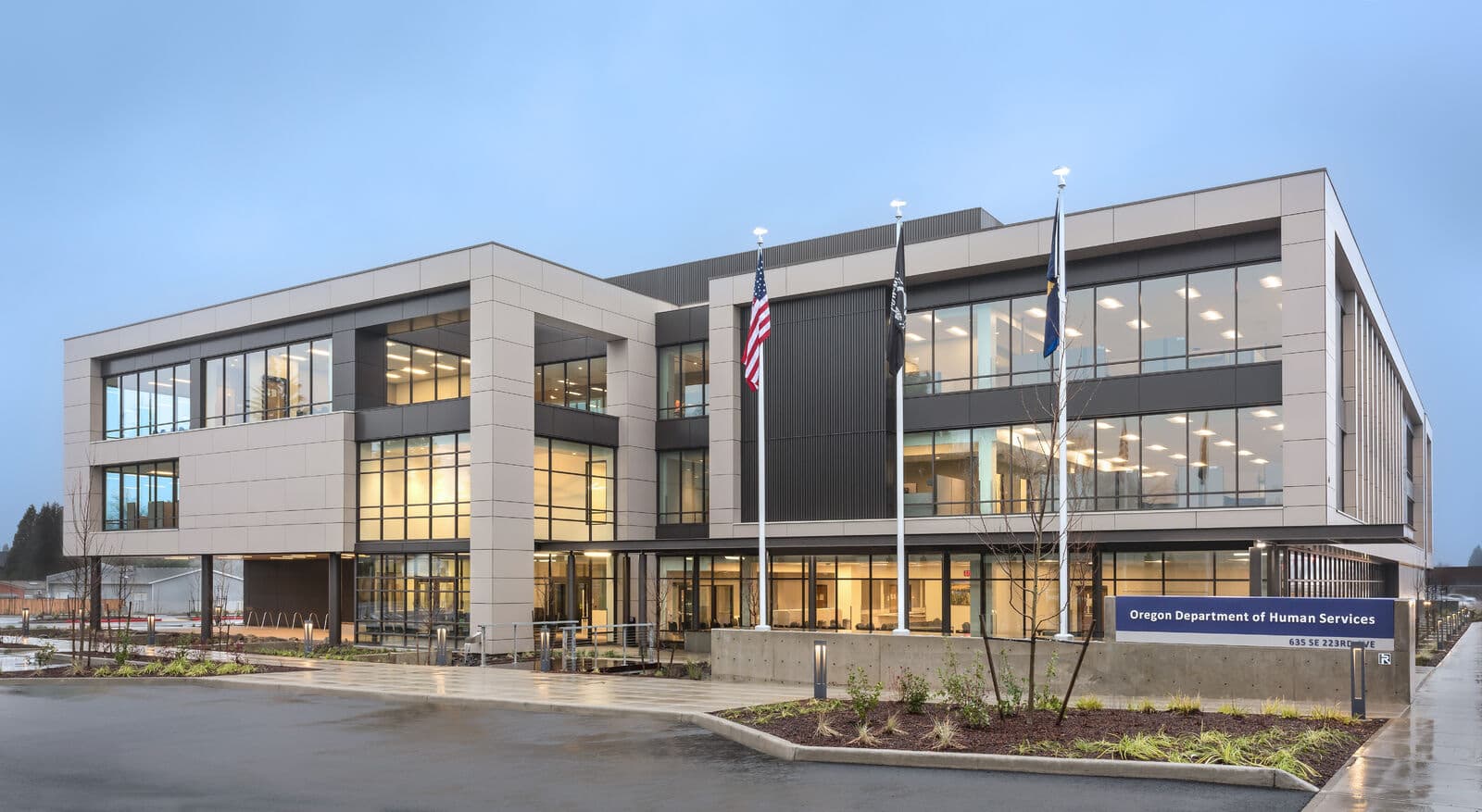 Exterior of the Oregon Department of Human Services Gresham field office at dusk